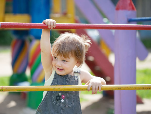 Toddler climbing in the playground